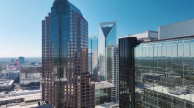 Aerial view of downtown district of Charlotte city in North Carolina, USA. Glass and steel high skyscraper buildings in modern american midtown.