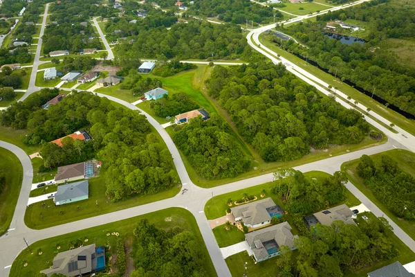 stock image Aerial landscape view of suburban private houses between green palm trees in Florida quiet rural area.