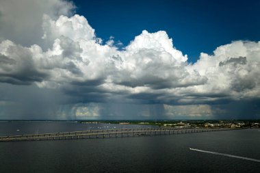 Barron Collier Bridge and Gilchrist Bridge in Florida with moving traffic. Transportation infrastructure in Charlotte County connecting Punta Gorda and Port Charlotte over Peace River.