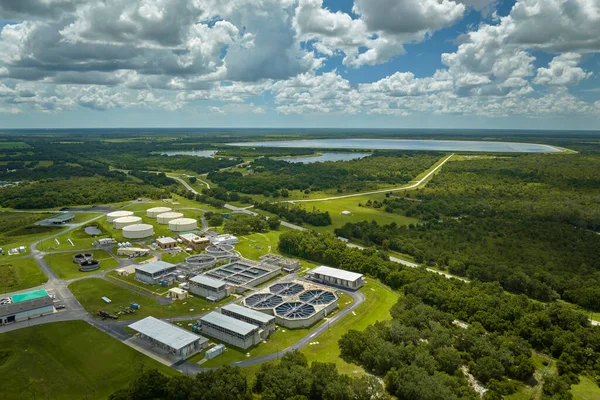 stock image Aerial view of modern water cleaning facility at urban wastewater treatment plant. Purification process of removing undesirable chemicals, suspended solids and gases from contaminated liquid.