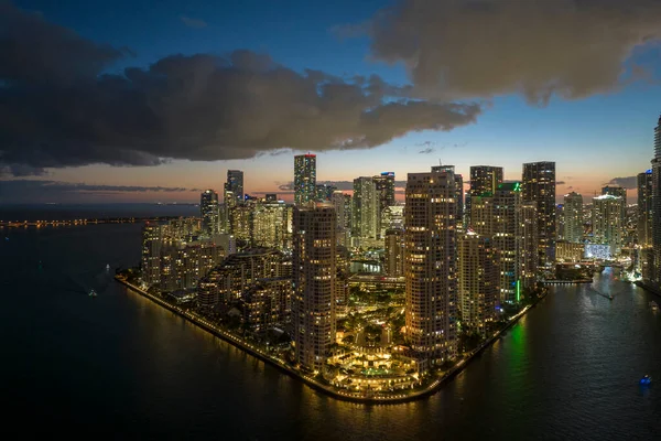 Aerial view of downtown district of of Miami Brickell in Florida, USA. Brightly illuminated high skyscraper buildings in modern american midtown.