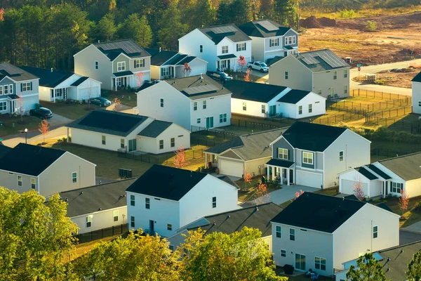 View from above of densely built residential houses in living area in South Carolina. American dream homes as example of real estate development in US suburbs.