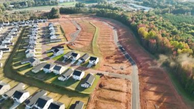 Real estate development with tightly located family houses under construction in South Carolina suburban area. Concept of growing american suburbs.