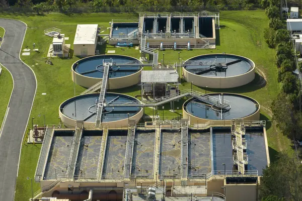 Aerial view of water treatment factory at city wastewater cleaning facility. Purification process of removing undesirable chemicals, suspended solids and gases from contaminated liquid.