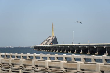 Sunshine Skyway Bridge over Tampa Bay in Florida with moving traffic. Concept of transportation infrastructure.