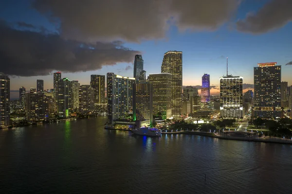 Aerial view of downtown district of of Miami Brickell in Florida, USA. Brightly illuminated high skyscraper buildings in modern american midtown.