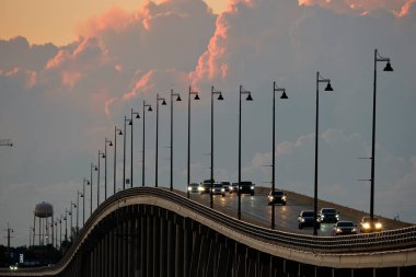 Barron Collier Bridge and Gilchrist Bridge in Florida with moving traffic. Transportation infrastructure in Charlotte County connecting Punta Gorda and Port Charlotte over Peace River.