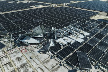 Consequences of natural disaster. Damaged by hurricane wind photovoltaic solar panels mounted on industrial building roof for producing green ecological electricity. clipart