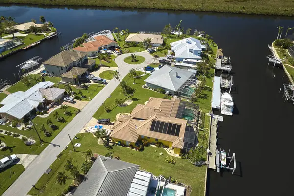 Damaged waterfront houses after hurricane Ian in Florida residential area. Consequences of natural disaster.