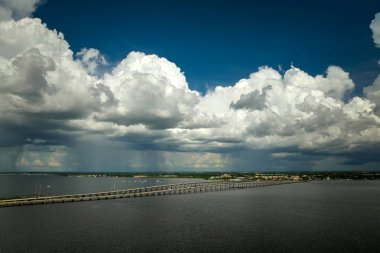 Barron Collier Bridge and Gilchrist Bridge in Florida with moving traffic. Transportation infrastructure in Charlotte County connecting Punta Gorda and Port Charlotte over Peace River.