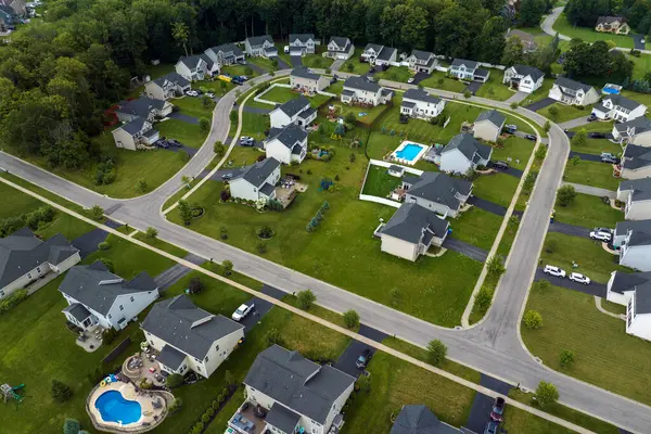 View from above of residential houses in living area in Rochester, NY. American dream homes as example of real estate development in US suburbs.