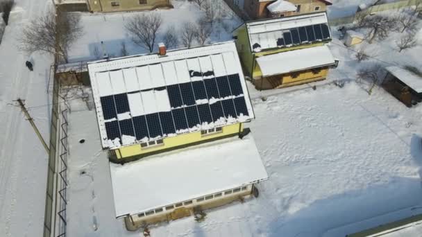Aerial View House Roof Solar Panels Covered Snow Melting Winter — стоковое видео
