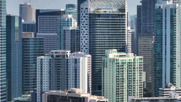 Miami Brickell in Florida, USA. Zoomed closeup telephoto footage. View from above of concrete and glass skyscraper buildings in downtown district. American megapolis with business financial district.