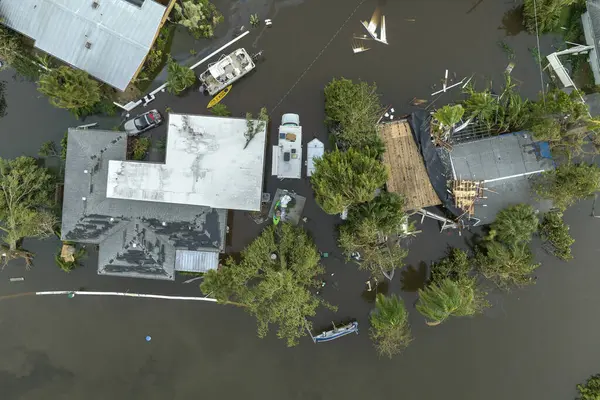Flooded houses by hurricane Ian rainfall in Florida residential area. Consequences of natural disaster.