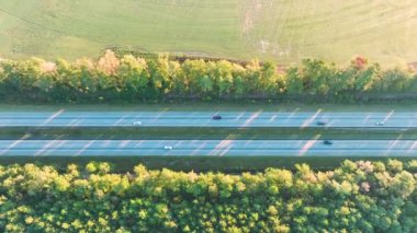 Aerial view of busy American highway with fast moving traffic. Interstate transportation concept.