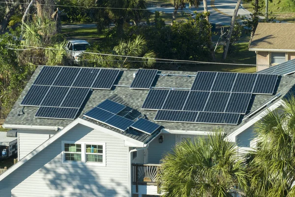 stock image Aerial view of typical american building roof with rows of blue solar photovoltaic panels for producing clean ecological electric energy. Renewable electricity with zero emission concept.