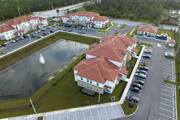 View from above of apartment residential condos in Florida suburban area. American condominiums as example of real estate development in USA suburbs.