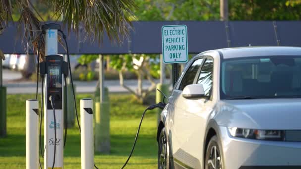 Electric Plug Car Charging Electricity Solar Renewable Power Source Parked — Stockvideo
