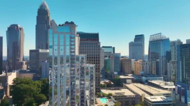 Aerial view of downtown district of Charlotte city in North Carolina, USA. Glass and steel high skyscraper buildings in modern American midtown.