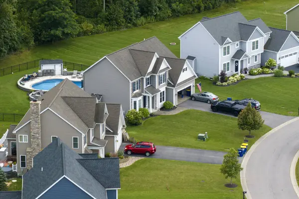 Housing market in the USA. Residential homes in suburban sprawl development in Rochester, New York. Low-density two story private houses in rural suburbs.