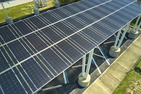 Solar panels installed over parking lot for parked cars for effective generation of clean energy.