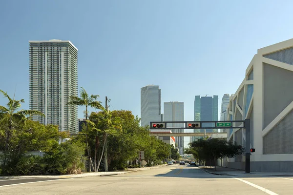 Traffic lights for traffic regulation high above street in Miami, Florida.