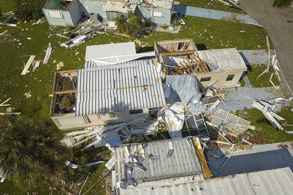 Destroyed by hurricane Ian suburban houses in Florida mobile home residential area. Consequences of natural disaster.