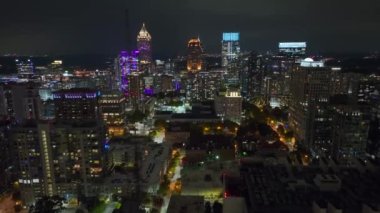 Night urban landscape of downtown district of Atlanta city in Georgia, USA. Skyline with brightly illuminated high skyscraper buildings in modern american megapolis.