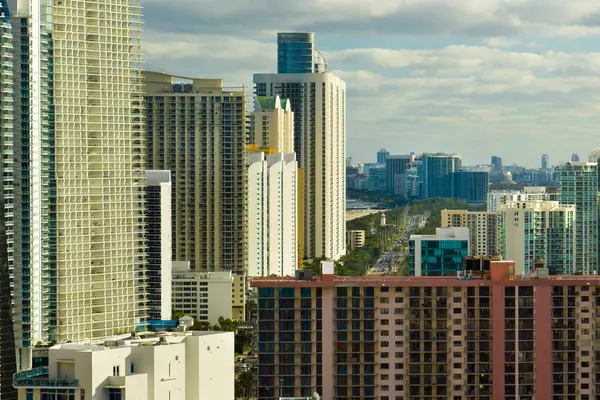 Expensive highrise hotels and condos on Atlantic ocean shore in Sunny Isles Beach city. American tourism infrastructure in southern Florida.