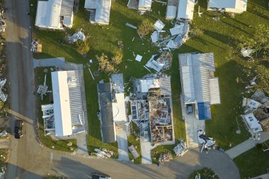 Severely damaged houses after hurricane Ian in Florida mobile home residential area. Consequences of natural disaster. clipart