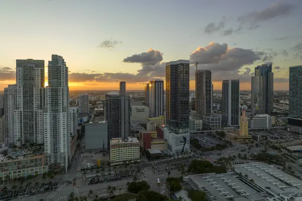 Evening urban landscape of downtown district of Miami Brickell in Florida, USA. Skyline with high skyscraper buildings and urban transportation system in modern american megapolis.