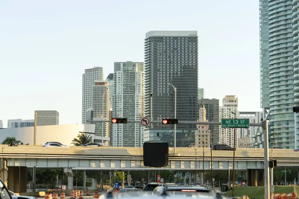 Traffic lights for traffic regulation high above street in Miami, Florida.