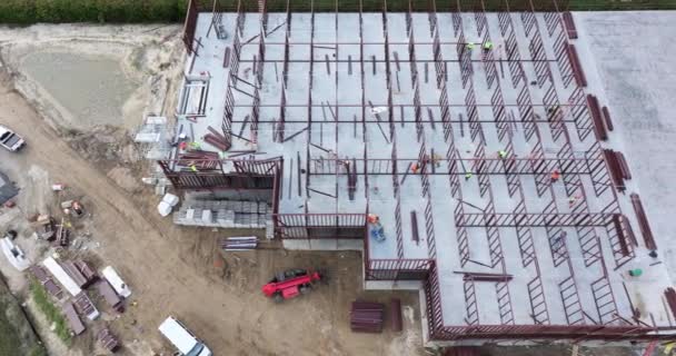 Industrial Construction Site Workers Assembling Metal Frame Building Development Residential — Stock Video