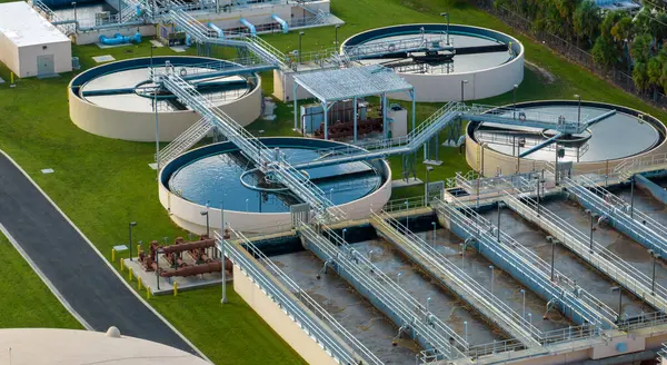 Aerial view of water treatment factory at city wastewater cleaning facility. Purification process of removing undesirable chemicals, suspended solids and gases from contaminated liquid.