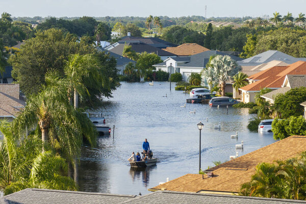 Flooded houses from hurricane Debby rainfall water in Laurel Meadows community in Sarasota, Florida. Aftermath of natural disaster in USA south. Sarasota, USA - August 6, 2024.