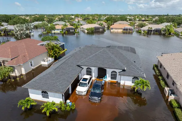 stock image Flooding in Florida caused by tropical storm from hurricane Debby. Suburb houses in Laurel Meadows residential community surrounded by flood waters in Sarasota. Aftermath of natural disaster.