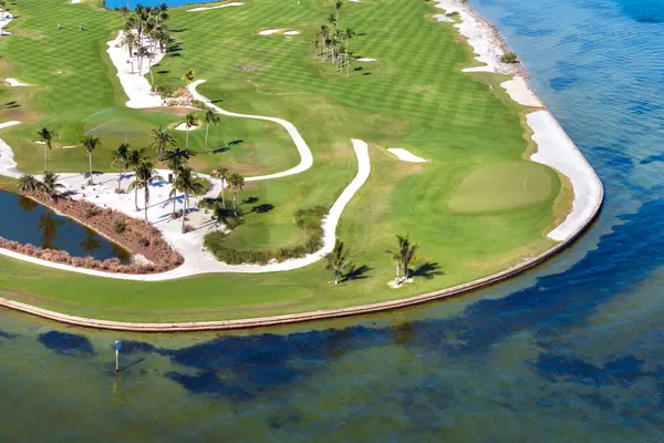 stock image Aerial view of large golf field with green grass in Boca Grande, small town on Gasparilla Island in southwest Florida. Outdoor activities for wealthy people.