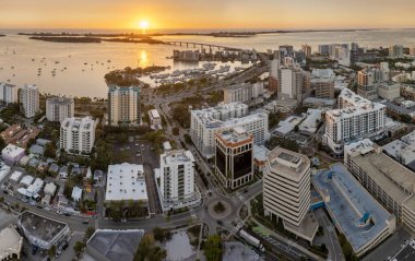 Sarasota, Florida at sunset. Luxury yachts docked in Sarasota Bay marina. American city downtown architecture with high-rise office buildings. USA travel destination. clipart