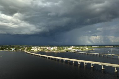 Barron Collier Bridge and Gilchrist Bridge in Florida with moving traffic. Transportation infrastructure in Charlotte County connecting Punta Gorda and Port Charlotte over Peace River.
