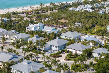 Expensive residential houses in island small town Boca Grande on Gasparilla Island in southwest Florida. American dream homes as example of real estate development in US suburbs.