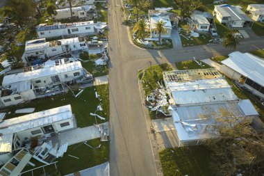 Badly damaged mobile homes after hurricane Ian in Florida residential area. Consequences of natural disaster. clipart