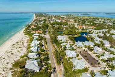 Expensive residential houses in island small town Boca Grande on Gasparilla Island in southwest Florida. American dream homes as example of real estate development in US suburbs.