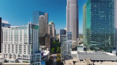 Urban landscape of downtown district of Charlotte city in North Carolina, USA. Skyline with high skyscraper buildings in modern American megapolis