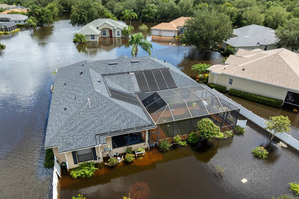 Hurricane Debby tropical rainstorm flooded residential homes in suburban community in Sarasota, Florida. Aftermath of natural disaster.