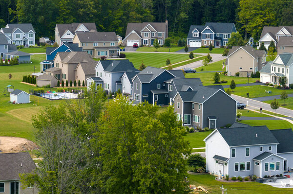 Housing market in the USA. Residential homes in suburban sprawl development in Rochester, New York. Low-density two story private houses in rural suburbs.