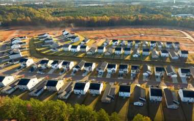 Real estate development with tightly located family houses under construction in South Carolina suburban area. Concept of growing american suburbs.