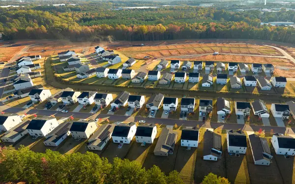 Real estate development with tightly located family houses under construction in South Carolina suburban area. Concept of growing american suburbs.