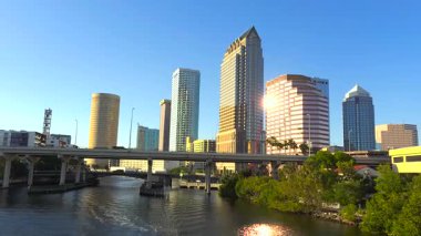Tampa, Florida skyline with commercial buildings and traffic on highway bridge over Hillsborough River