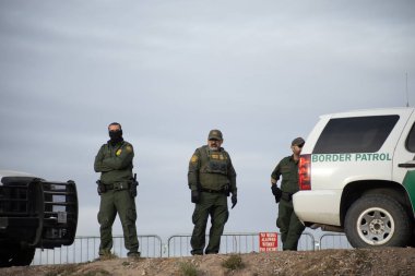 Juarez, Mexico, 11-15-2022: Border Patrol agents monitor the migrant camp set up in Mexican territory on the Juarez El Paso Texas border.