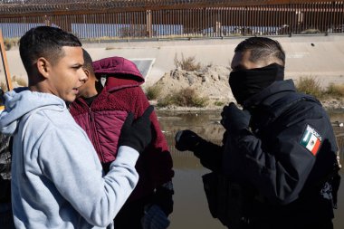 Juarez, Mexico, 11-27-2022: City Juarez Municipal Police and National Guard evacuate a camp for Venezuelan migrants installed on the border between Mexico and the United States